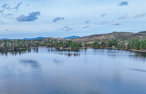 Oquossoc Cabin | Lakefront cabin with screened porch, woodstove, & water access - dog-friendly