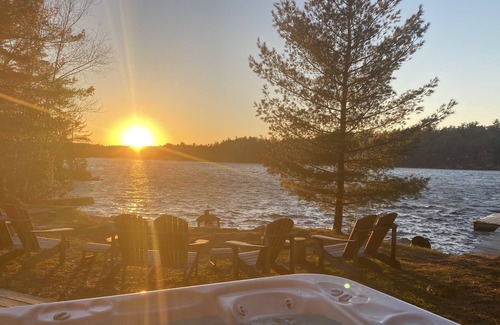 Leeds and the Thousand Islands Cottage | Lakefront, colourful sunsets, hot tub, arcade. Year round fun and relaxation.