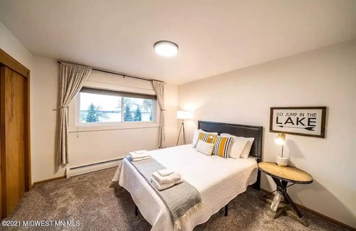 Detroit Lakes Condo | Lakefront Condo, 2 bedroom, with Dock & Private Patio! Walk to Restaurants!