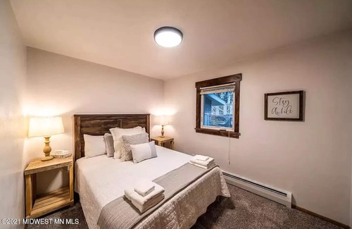 Detroit Lakes Condo | Lakefront Condo, 2 bedroom, with Dock & Private Patio! Walk to Restaurants!