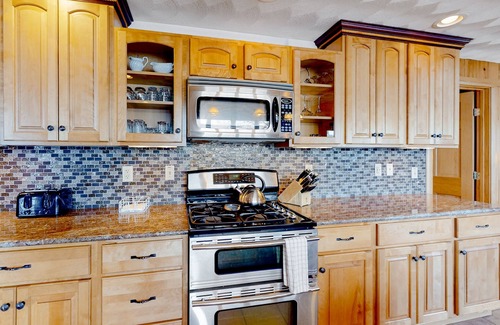 Norway House | Lakefront, dog-friendly home with dock, kayaks, SUPs, canoe, huge deck & firepit