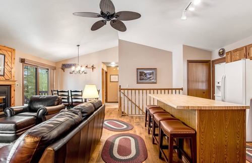 Lac du Flambeau House | Lakefront home with firepit, screened porch, WiFi, central AC, and kayaks
