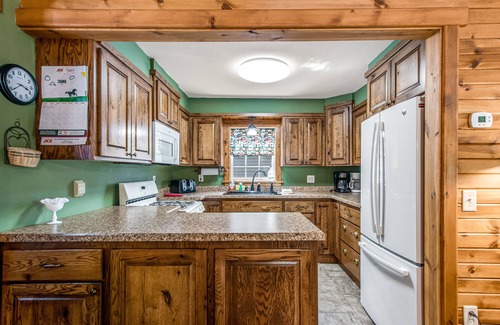 Arbor Vitae House | Lakefront home with dock, fireplace, deck, firepits & fast WiFi - dog-friendly