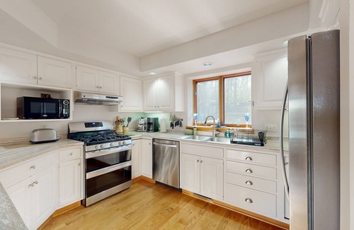 Hazelhurst House | Lakefront home with private outdoor sauna, dock, firepit, wood fireplace & patio