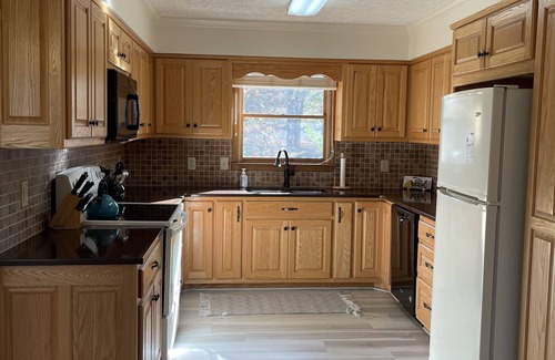 Winchester House | Lakefront home with dock. Cozy 2 bed 2 bath and screened in porch.