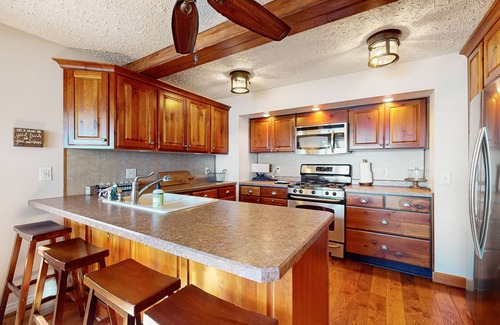 Lac du Flambeau House | Lakefront house with private covered hot tub, dock, wood fireplace, & firepit