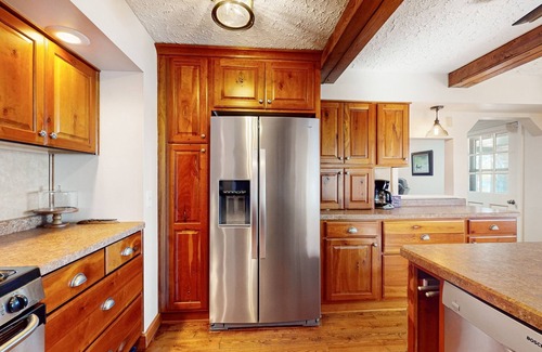 Lac du Flambeau House | Lakefront house with private covered hot tub, dock, wood fireplace, & firepit