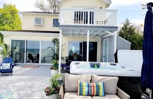 Mentor-on-the-Lake House | Lakefront Oasis Retreat Private Beach-Hot Tub-Pet Friendly-3 Bd/2 B-King Suite