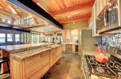 Sandpoint House | Lakefront property w/boat lift, hot tub & steam room