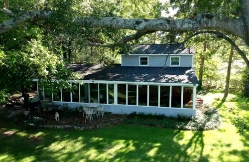 Montgomery House | Lakehouse on a small private lake situated on 1.2 acres of lakefront property.