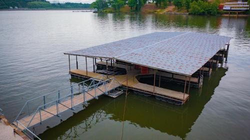 Lake Ozark House | Lakeshore Fishing Cabin 5, dock, boat slip and firepit area