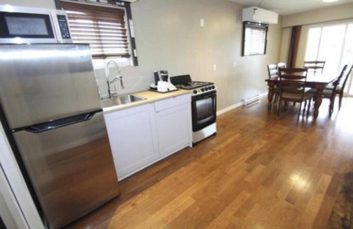 Harrison Hot Springs Cabin | lakeside bedroom and a living area with stunning views of Harrison Lakennn