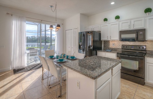 Lake Berkley Villa | Lakeside house, huge south facing pool with spa, lake view, & Disney at 8 miles