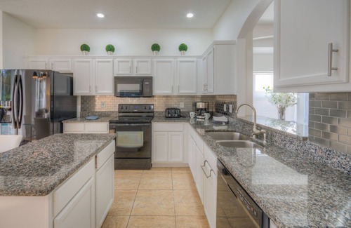 Lake Berkley Villa | Lakeside house, huge south facing pool with spa, lake view, & Disney at 8 miles