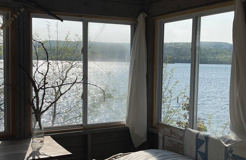 Rome Cabin | Lakeside Lodging, Elevated - Walk to Village shops and restaurants and enjoy a private lakefront, newly renovated and furnished 1843 home!
