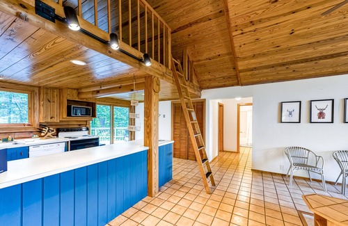Blue Water House | Lakeside log home with a private deck, WiFi, firepit, central AC, & washer/dryer