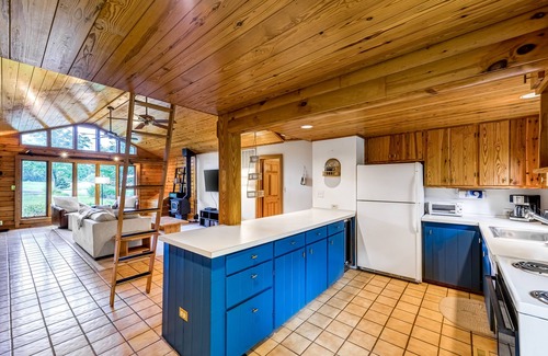 Blue Water House | Lakeside log home with a private deck, WiFi, firepit, central AC, & washer/dryer