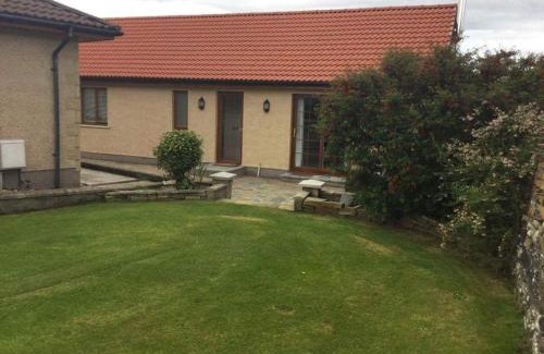 Wick House | Langley Cottage with patio, spacious rooms - part of Langley Serviced Apartments several properties in Wick