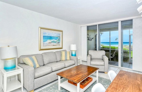 Longboat Key Apartment | LaPlaya 101A Step out to the beach from your screened lanai Light and bright end unit