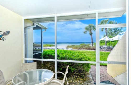 Longboat Key Apartment | LaPlaya 101A Step out to the beach from your screened lanai Light and bright end unit
