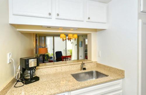 Longboat Key Apartment | LaPlaya 101E-Relax on your private lanai under the palms!