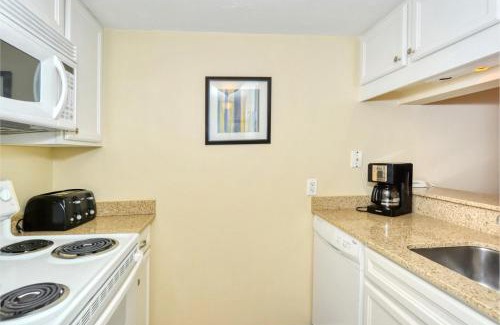 Longboat Key Apartment | LaPlaya 101E-Relax on your private lanai under the palms!