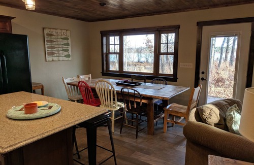 Lake Shore Cabin | Large lake front cabin, has 2 kitchens and comes with a pontoon! Bring the fam!