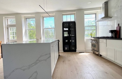 Le Claire House | LeClaire historic stone house with modern updates, river views and large yard