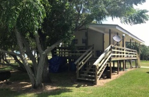 Elmaton Cabin | Little cabin sits on river w/lighted fishing pier