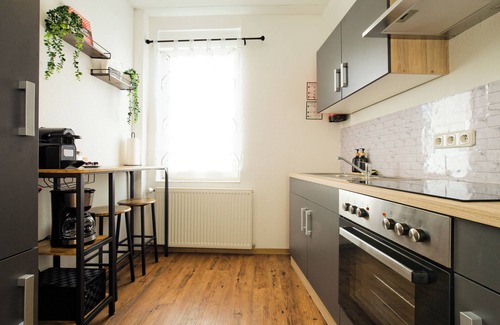 Fulda Apartment | Living La Christal apartment with workspace & games