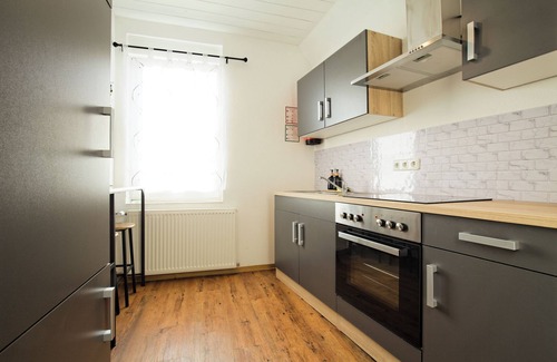 Fulda Apartment | Living La Christal apartment with workspace & games