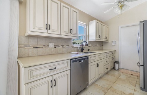 Gardens of Gulf Cove House | Located in an active community w/heated pools, tennis courts and shuffleboard