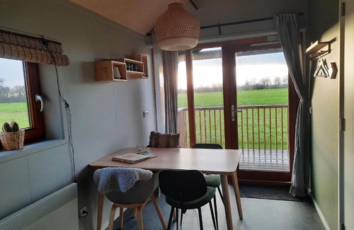 Ruinerwold House | Lodge with covered veranda in the fields of Ruinerwold