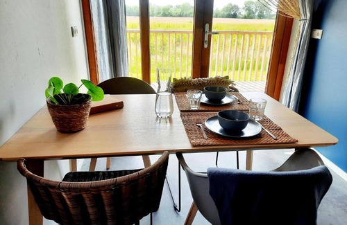 Ruinerwold House | Lodge with covered veranda in the fields of Ruinerwold