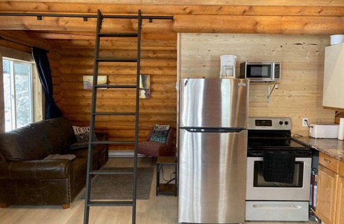 Central Okanagan Apartment | Log lofted rustic cabin in woods