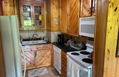 Rye Valley House | Lovely cottage by stream with caboose and covered bridge over trout stream