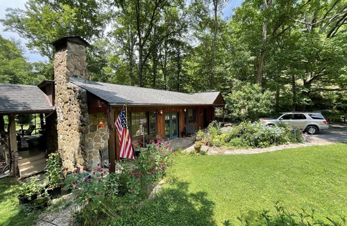 Rye Valley House | Lovely cottage by stream with caboose and covered bridge over trout stream