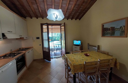 Rosignano Marittimo Apartment | Lovely flat with private covered terrace, pool, large shared garden.