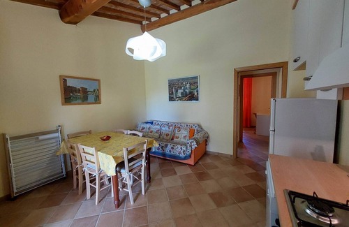 Rosignano Marittimo Apartment | Lovely flat with private covered terrace, pool, large shared garden.