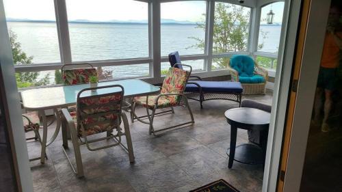 Plattsburgh Apartment | Loza house adirondack screened-in porch unit lake front
