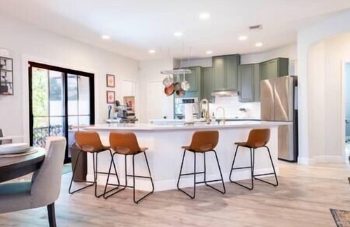Wetmore House | Luxe Home-Designer BTHRM-Covered Deck-Weber Grill