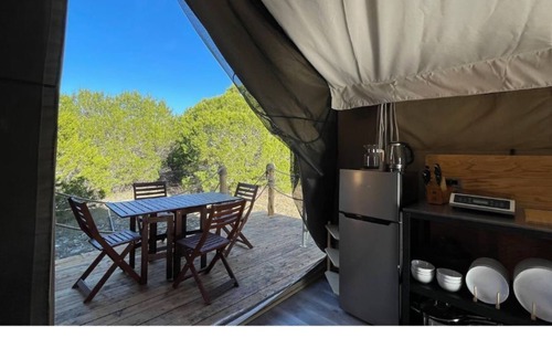 Kempner Cabin | Luxe safari tent + river & exotic wildlife