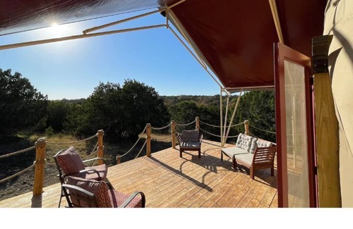 Kempner Cabin | Luxe safari tent + river & exotic wildlife
