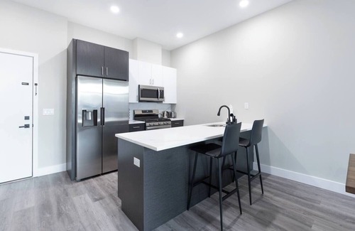 The Heights Apartment | Luxe Suite by NYC w Rooftop & Parking on Premises