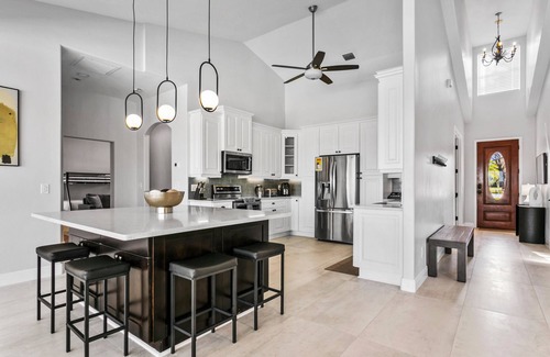Westchase House | Luxe Waterfront Hideaway w Pool & Pirate Ship Dock