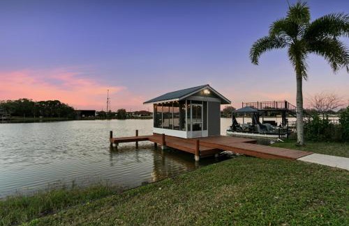 Westchase House | Luxe Waterfront Hideaway w Pool Pirate Ship Dock