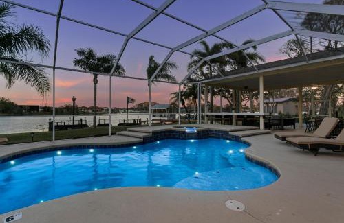 Westchase House | Luxe Waterfront Hideaway w Pool Pirate Ship Dock