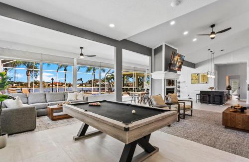 Westchase House | Luxe Waterfront Hideaway w Pool Pirate Ship Dock