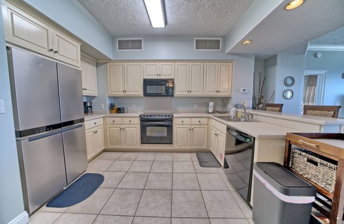 Thomas Drive Condo | Luxurious Beachfront Condo with Beachside Pool Access and Free WiFi - Unit 1202 by RedAwning