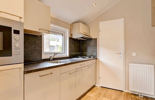 Hoge Hexel Ski Chalet | Luxurious lodge with airco, located beside a lake
